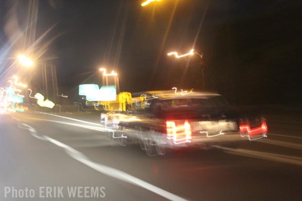 Lincoln car at night smeared colors of lights